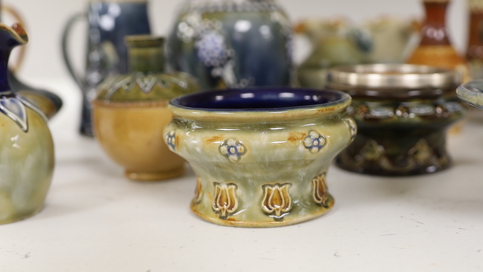 Sixteen miniature Doulton Stoneware items including bowls, vases, jugs, etc., tallest, 14.5cm